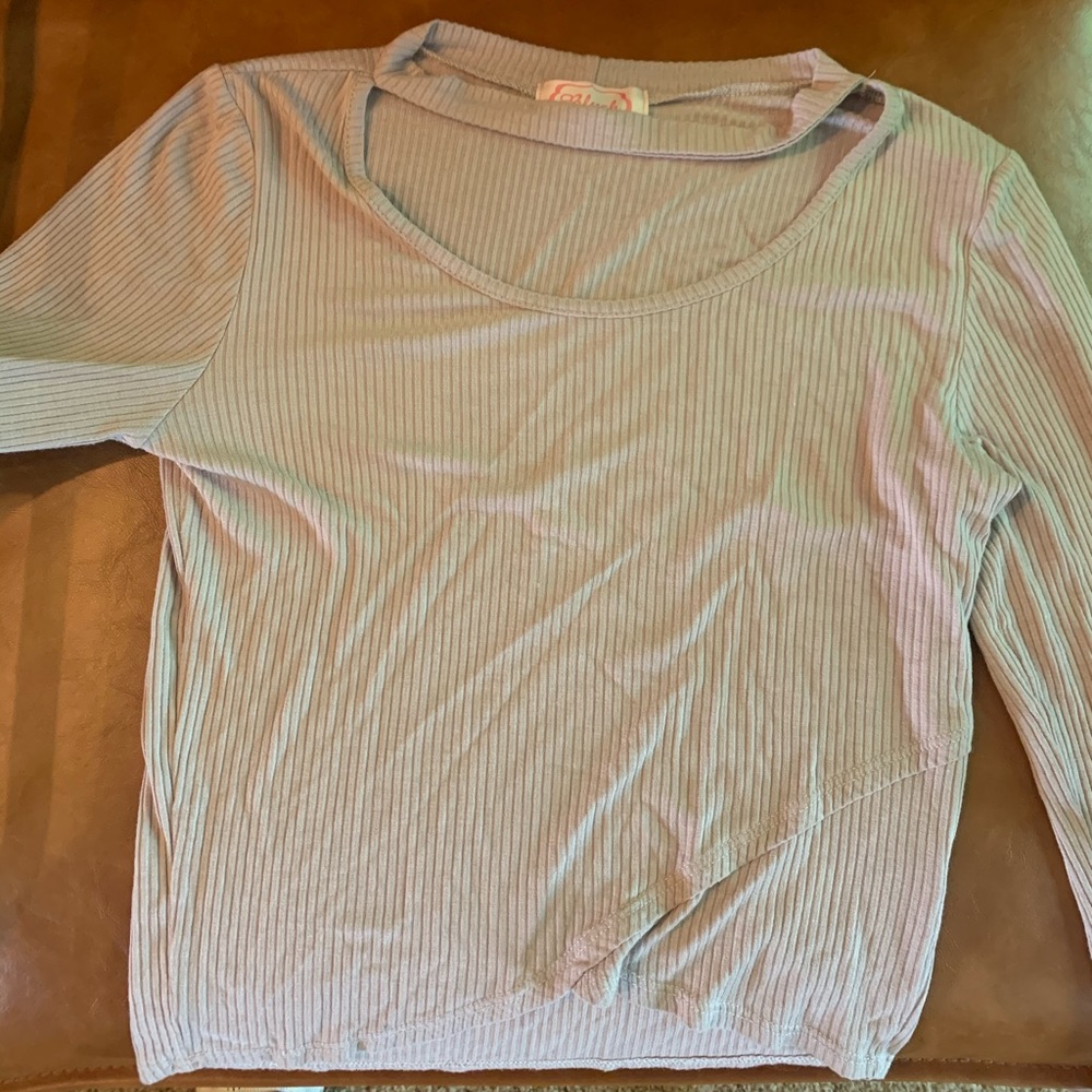 Thin khaki colored shirt.